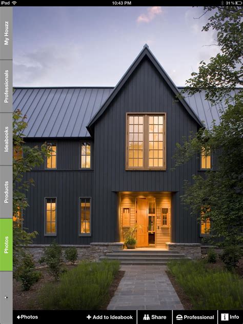 grey metal roof on grey house|gray exterior with black trim.